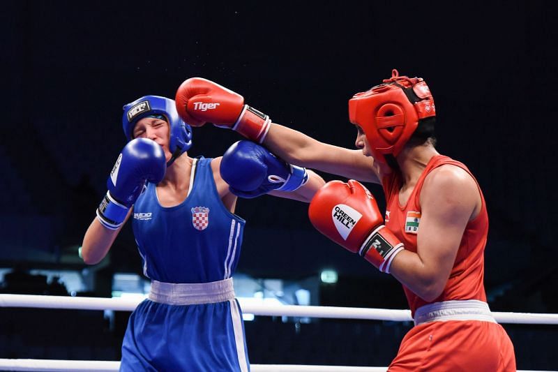 Sakshi of India in Red in action against Nikolina of Croatia (Image Courtesy: AIBA)